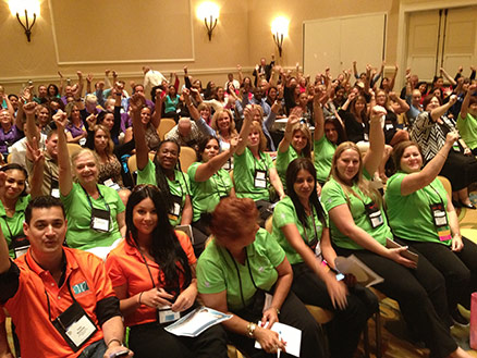 Motivational Speaker Linda Larsen Audience with Colorful Shirts Participation