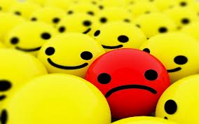 Red Sad Face in See of Yellow Happy Faces 2