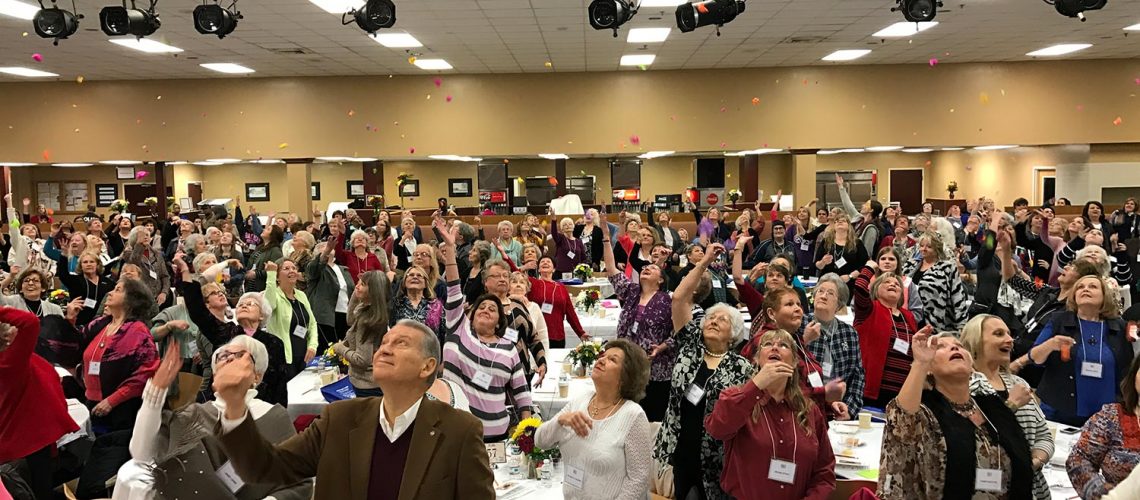 Motivational Speaker Linda Larsen's Audience Looking Up and Having Fun